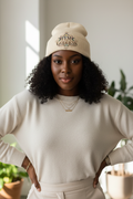 Black woman wearing FEM GODDESS skully beanie