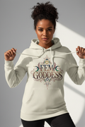 Brown-skinned woman wearing FEM GODDESS hoodie in elegant gold lettering