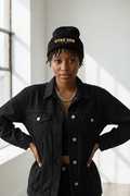 Black woman wearing DYKE GOD skully beanie