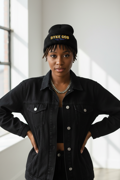 Black woman wearing DYKE GOD skully beanie